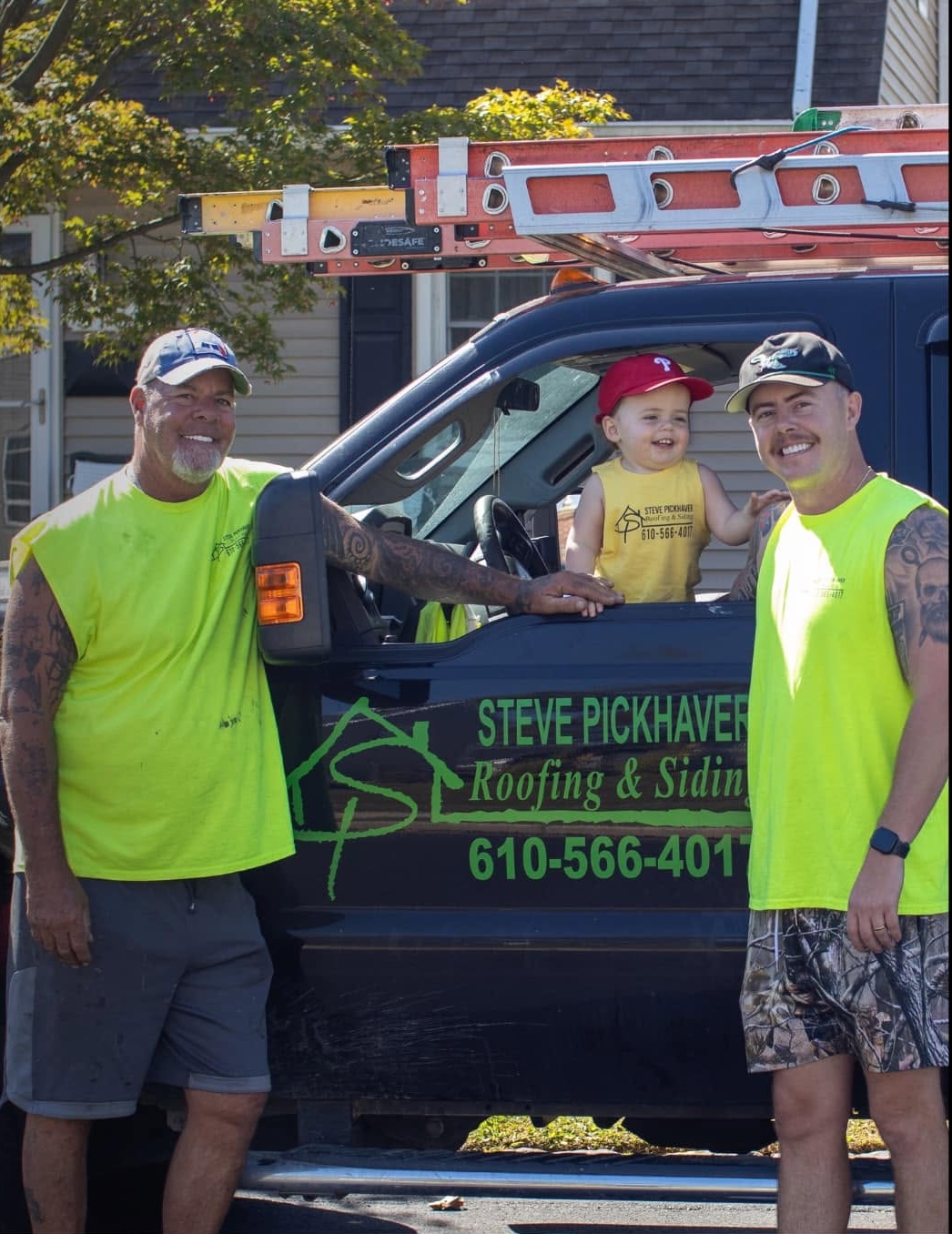 Steve Pickhaver and son with the Pickhaver Roofing & Siding truck